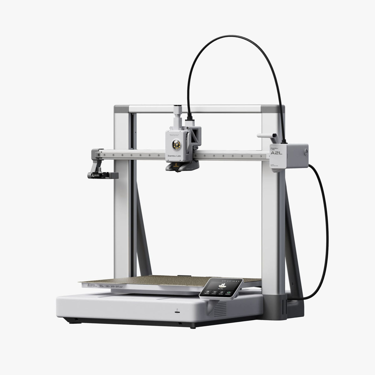 Bambu Lab A2L 3D printer with white frame, heated build plate, and black filament spool holder