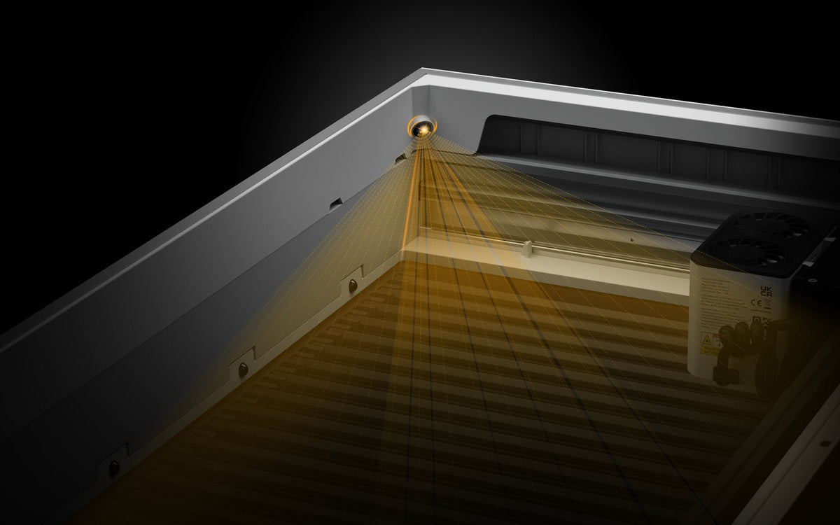 Aliencell X1 laser engraver showing golden light beam pattern demonstration from diode laser
