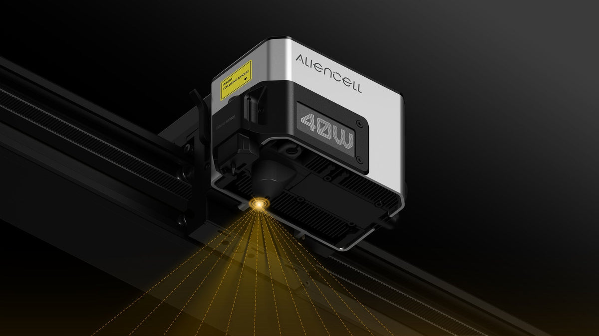Aliencell X1 40W diode laser engraver mounted on rail with air assist, showing beam pattern from above