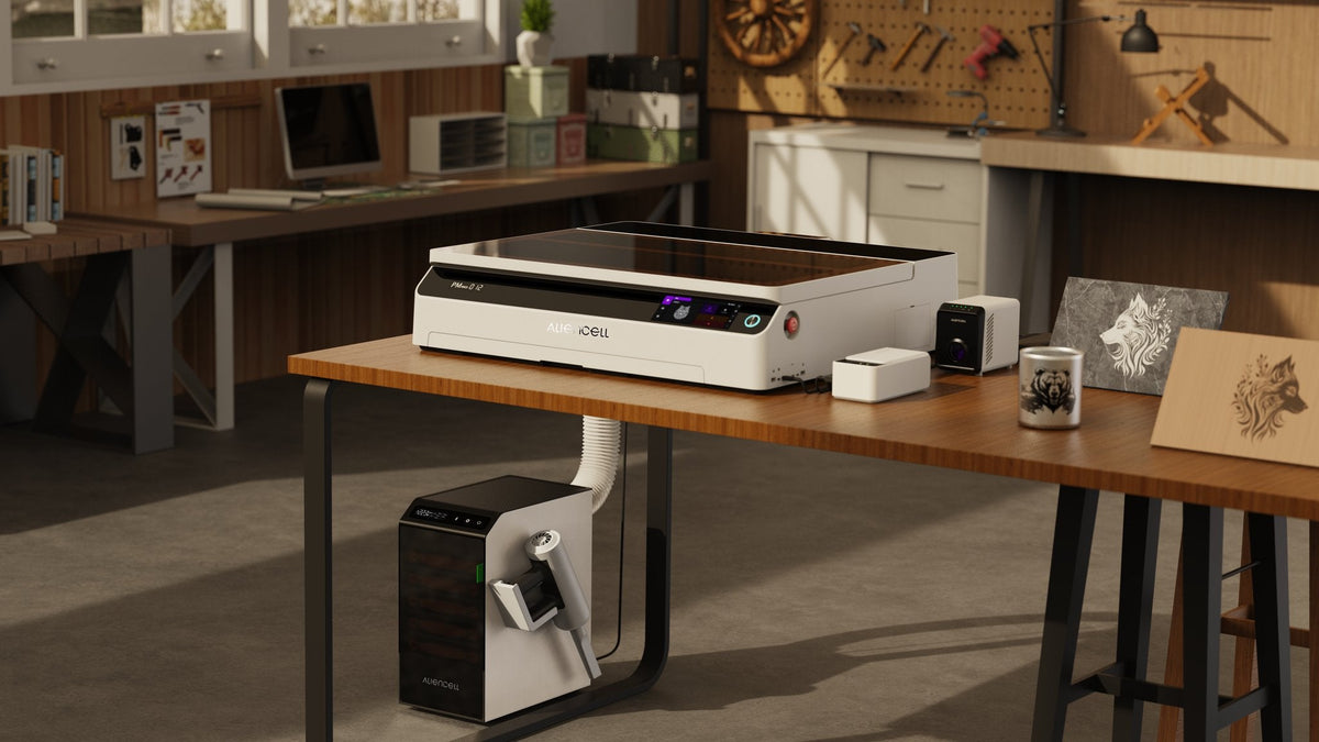 Aliencell X1 Diode Laser Engraver with air assist unit on wooden workbench in craft studio